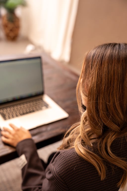 Focused professional working on laptop in natural light