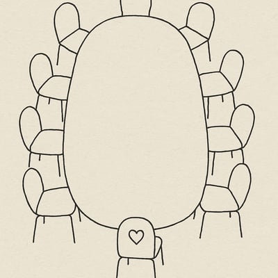 Bovenaanzicht van een vergadertafel met een lege stoel die subtiel op empathie wijst; beeldt de noodzaak van emotionele vaardigheden bij samenwerking en werkdruk uit.