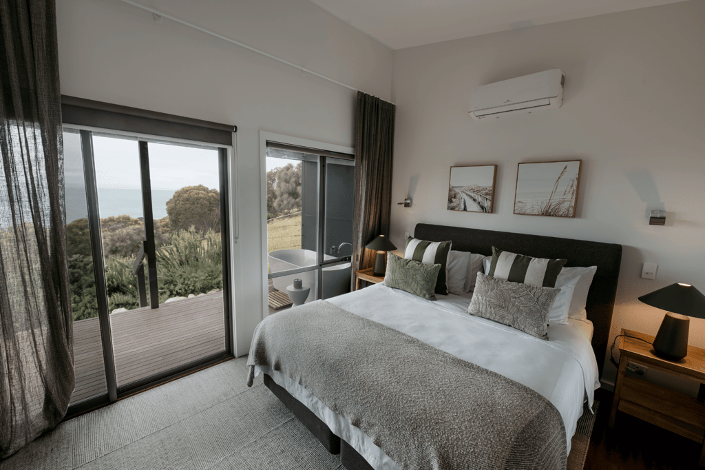 Spacious and elegantly designed room at Sea Dragon Lodge, a luxury lodge in Australia, featuring modern amenities and breathtaking views of Kangaroo Island, perfect for a serene escape.