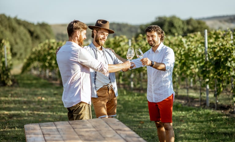 Guys tasting wine on the vineyard
