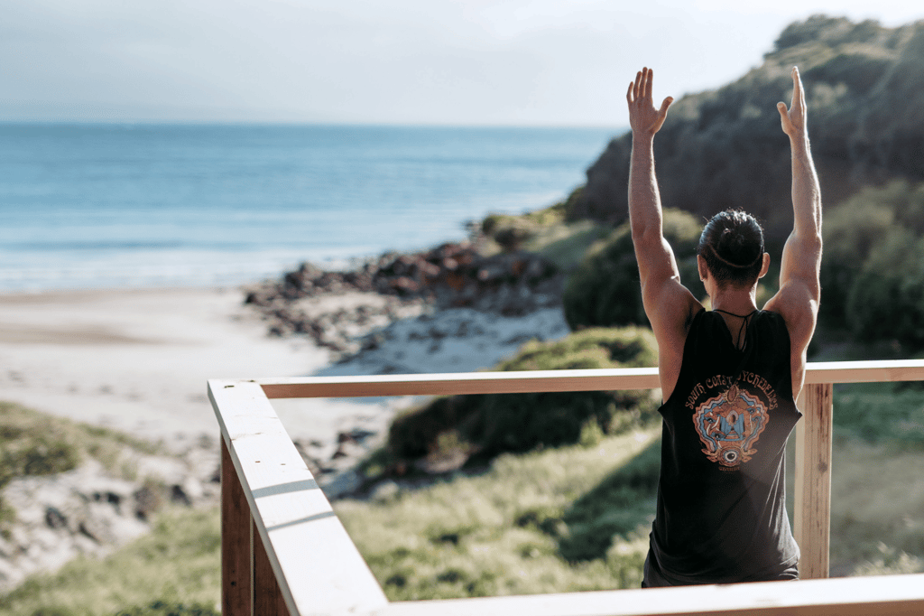 Serene yoga session on the stunning beaches of Kangaroo Island, Australia, where participants connect with nature and experience tranquility amidst breathtaking coastal views