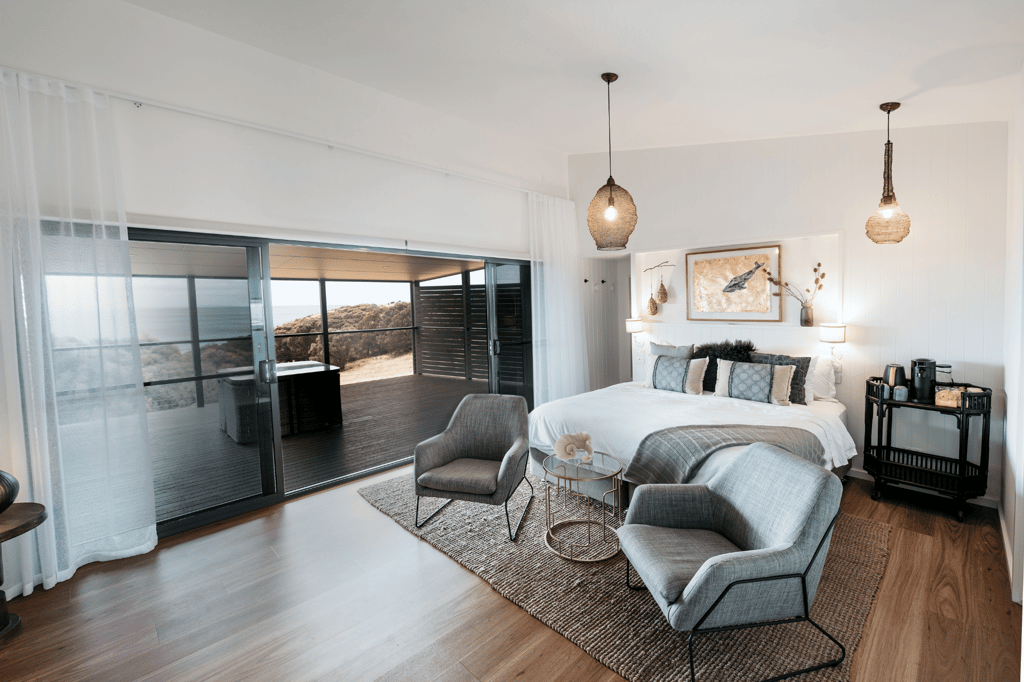 Cozy and elegantly designed room at Sea Dragon Lodge, featuring plush furnishings and large windows that offer stunning views of Kangaroo Island's natural beauty. Perfect for a relaxing getaway.