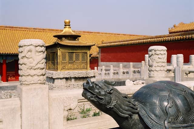 Bronze turtle and golden roofs in the Forbidden City