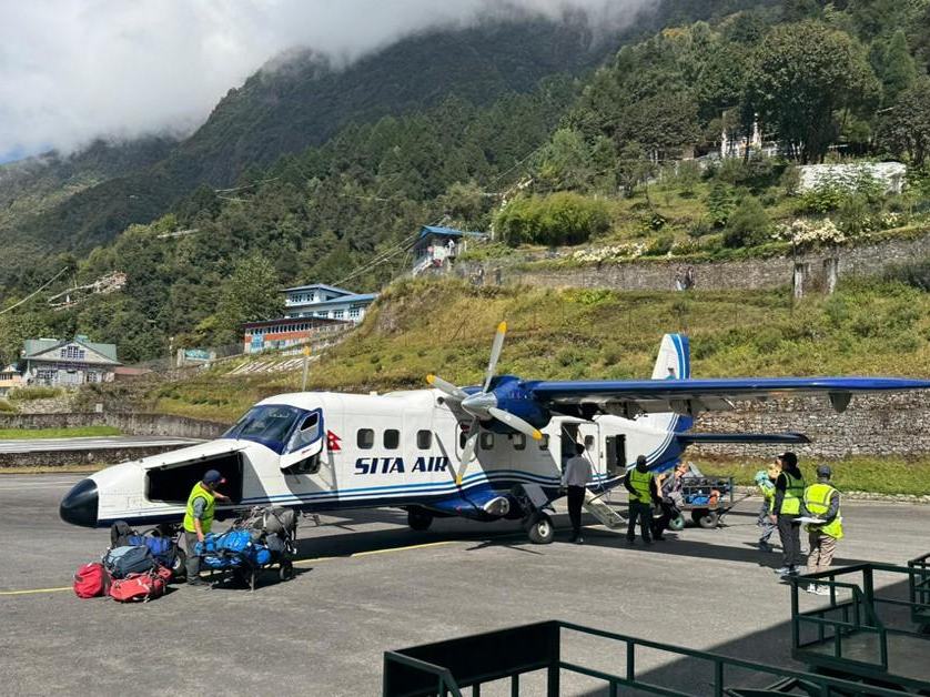 Offloading duffle bags in Lukla Airport