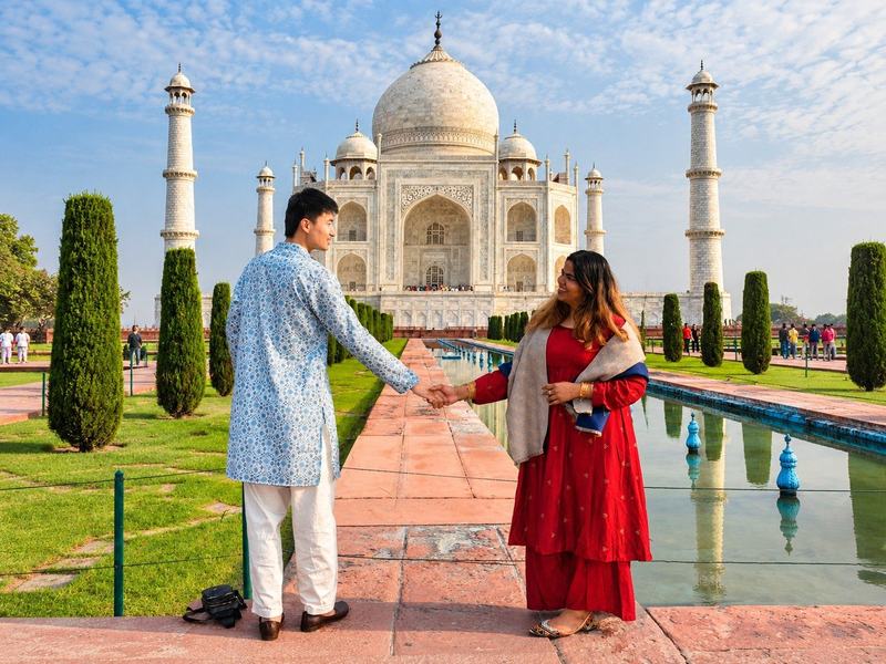 Be at the Taj Mahal gates as they open, half an hour before sunrise.