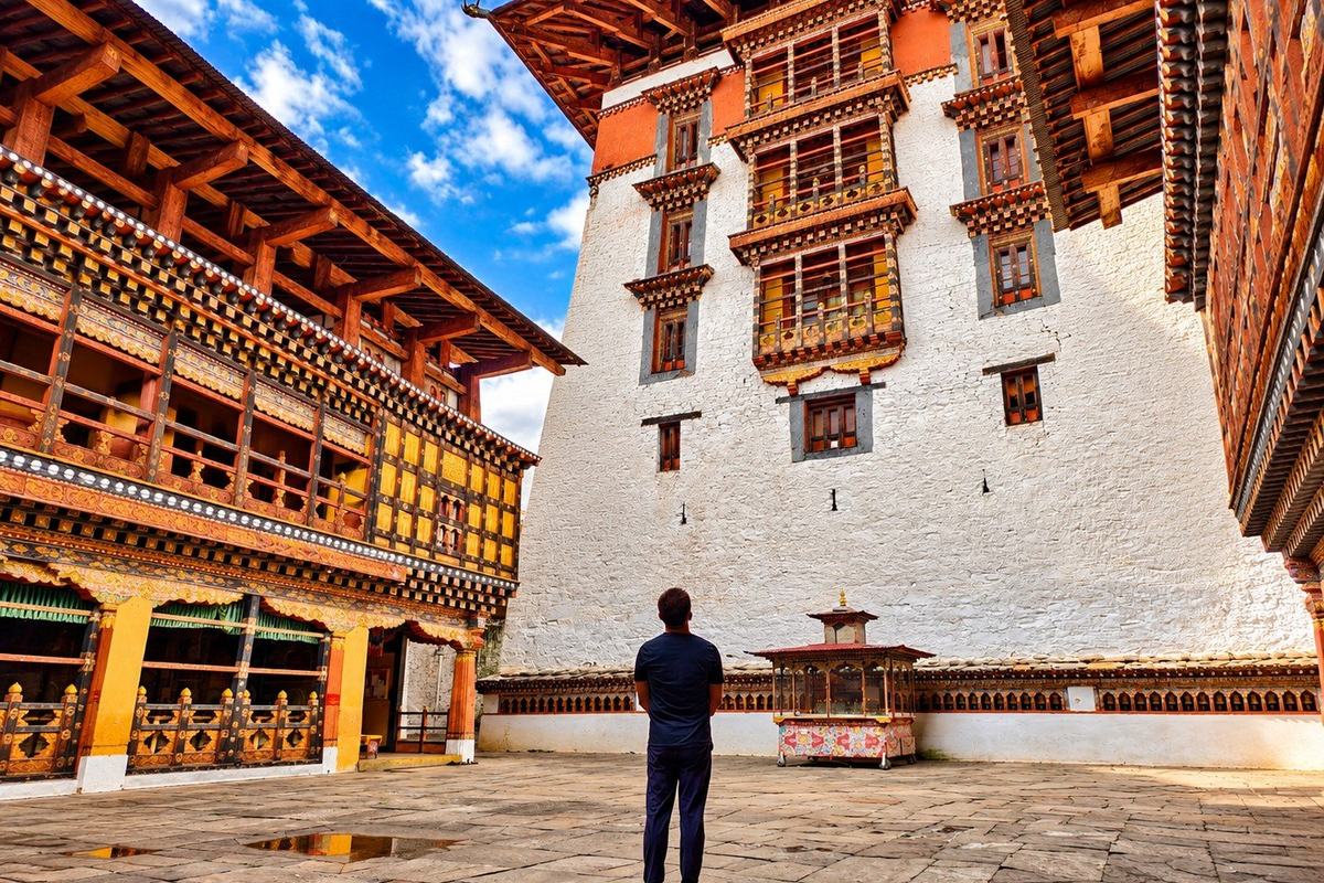 Traveller in the courtyard of Rinpung Dzong, Paro Dzong, Bhutan