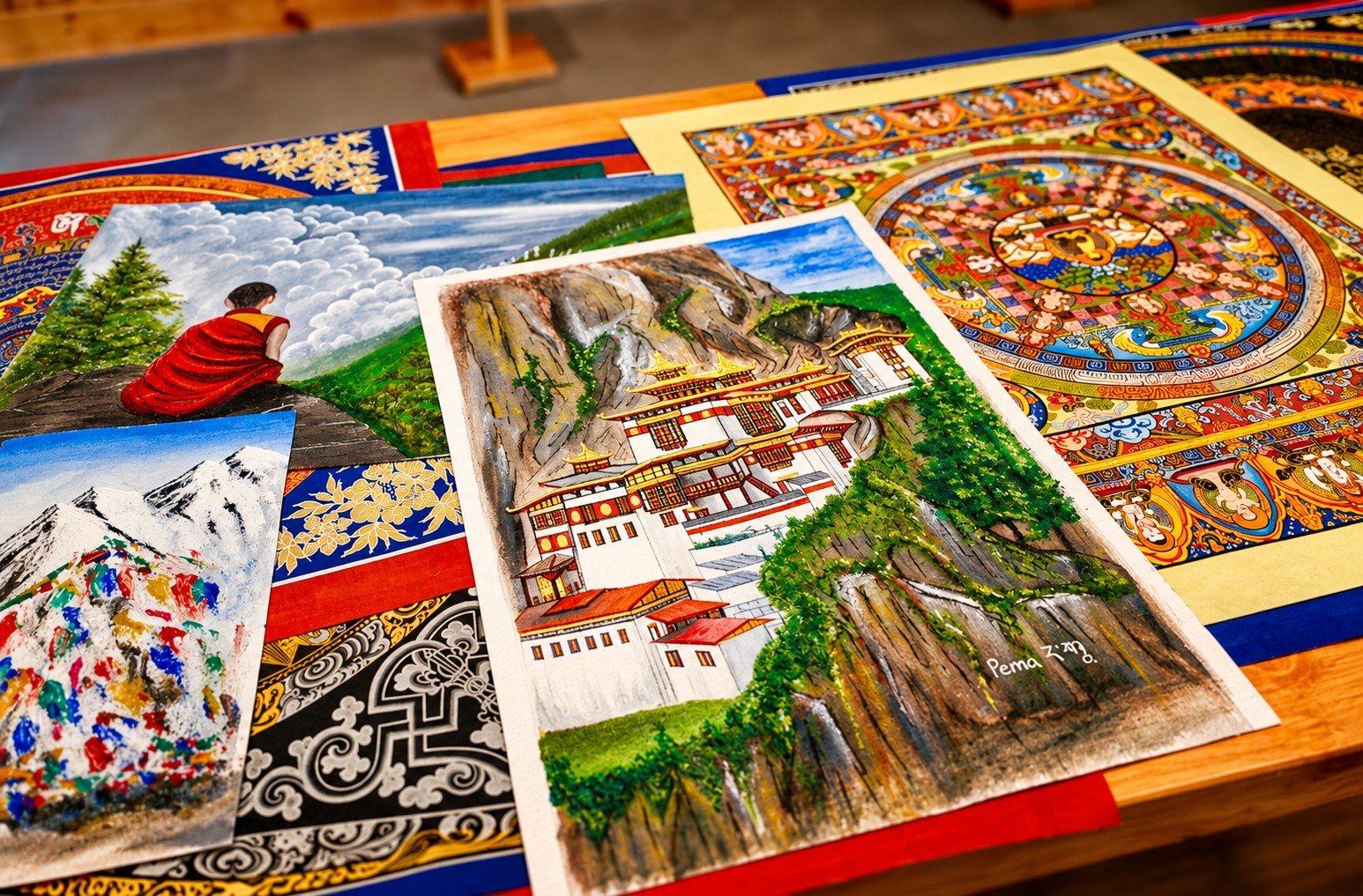 Hand-painted thangka art and a painting of Tiger's Nest, Bhutan