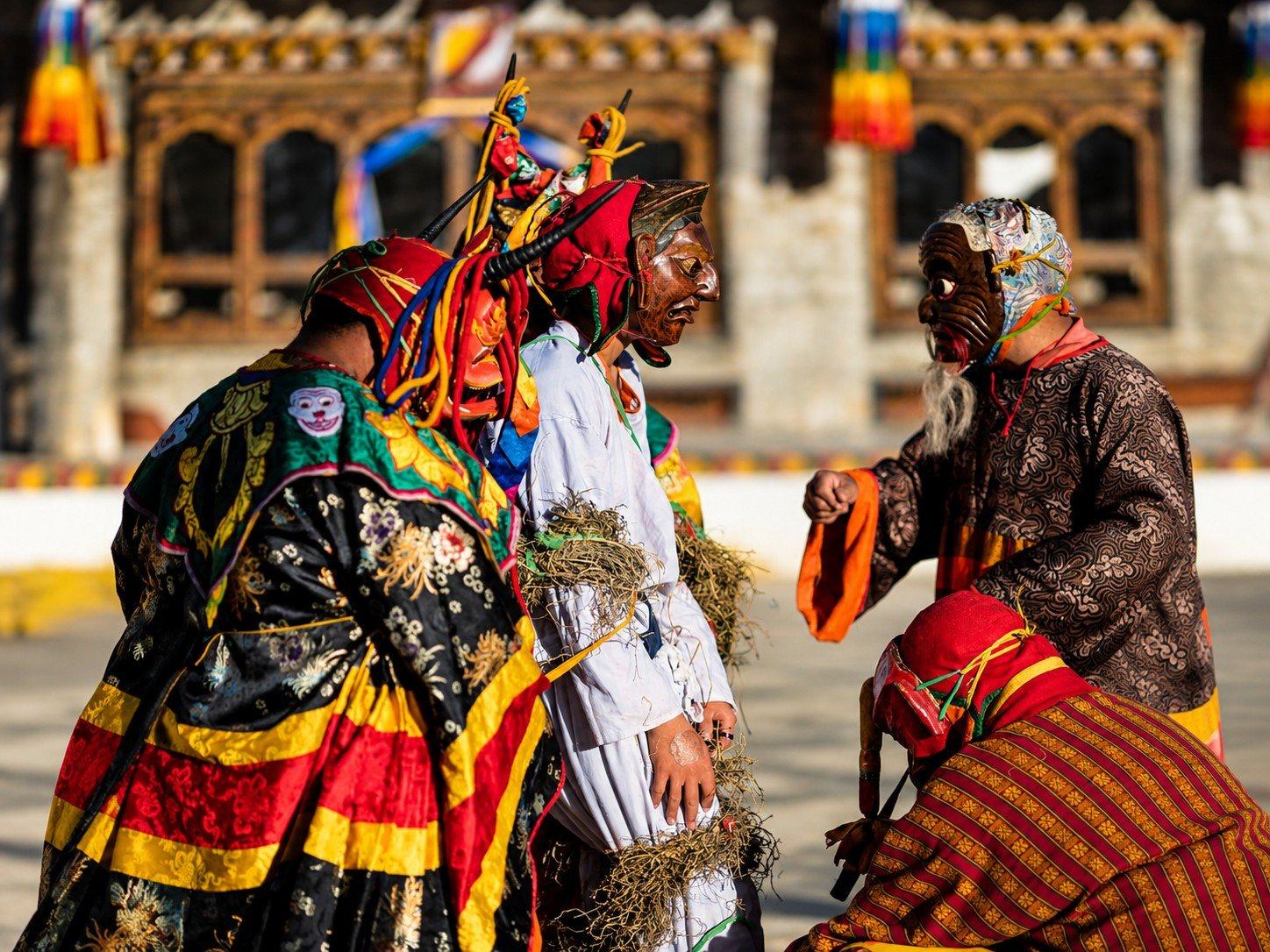 Masked dancers at a tshechu festival in Bhutan