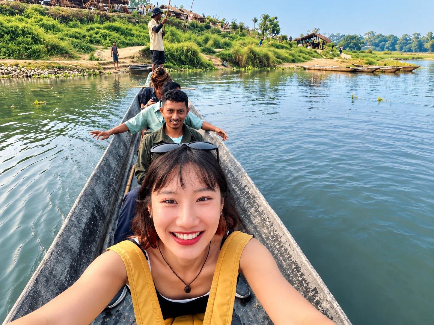 A smiling traveller taking a selfie in a dugout canoe on the river at Chitwan, Nepal