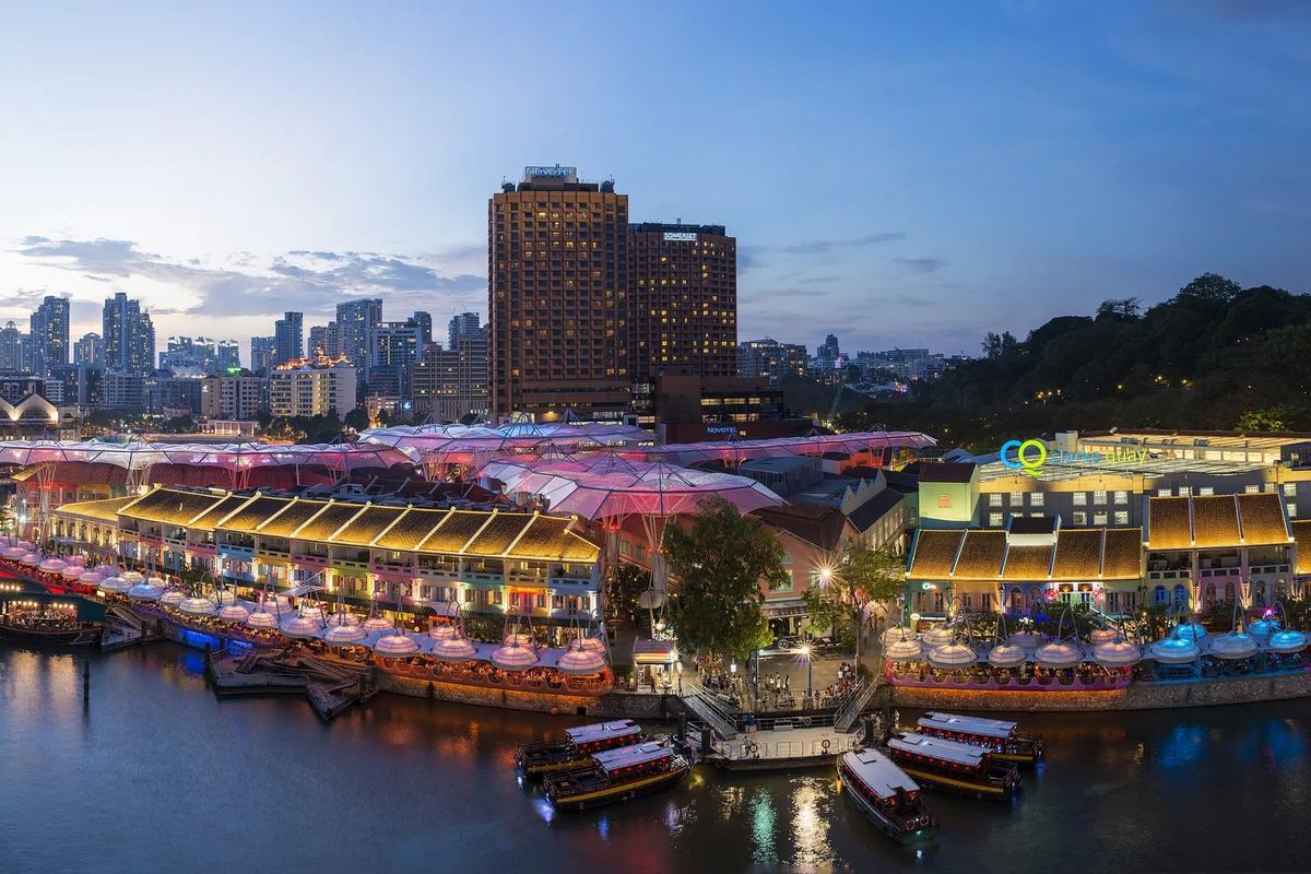 Clarke Quay and its moored bumboats from above at dusk, Singapore
