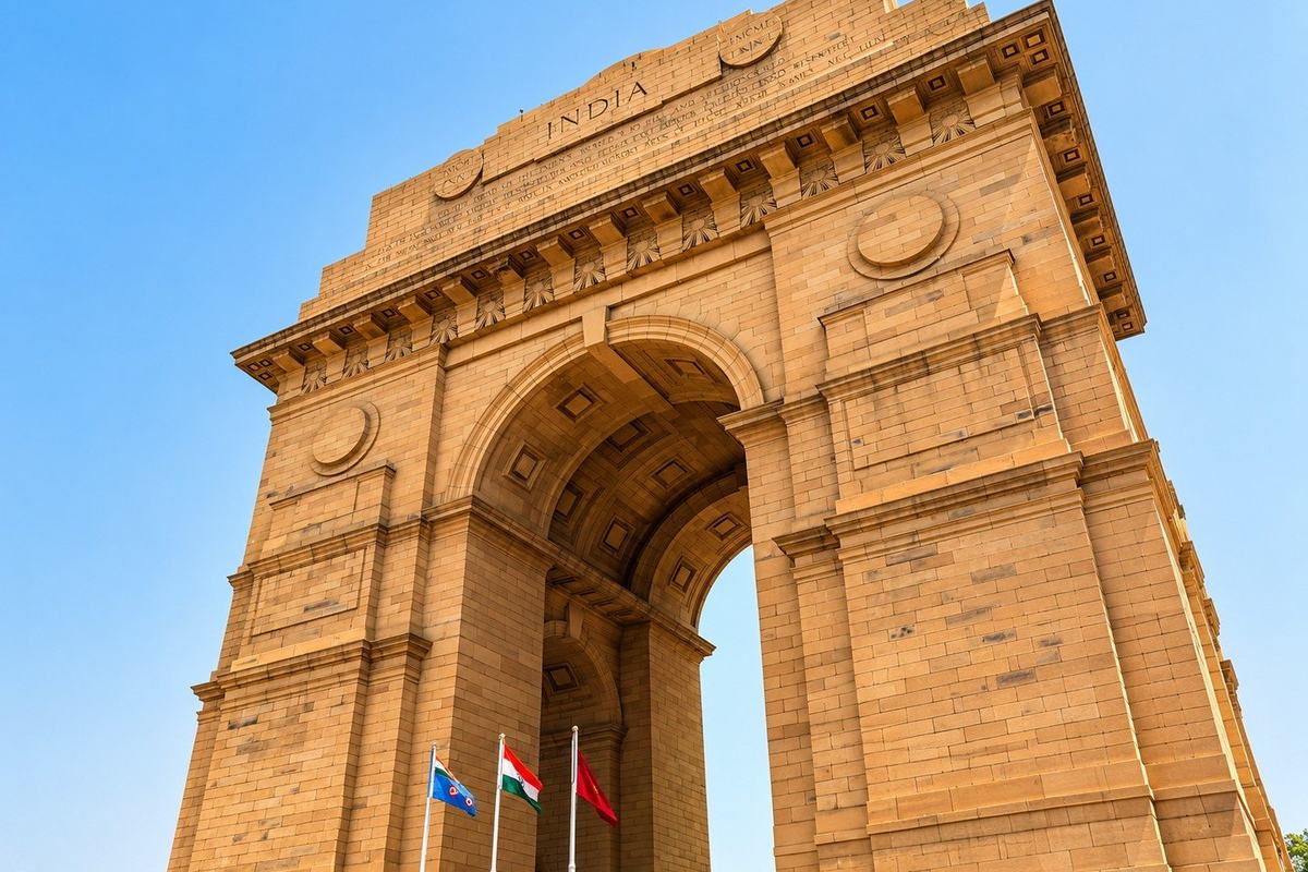 India Gate from below with the national flag, Delhi, India