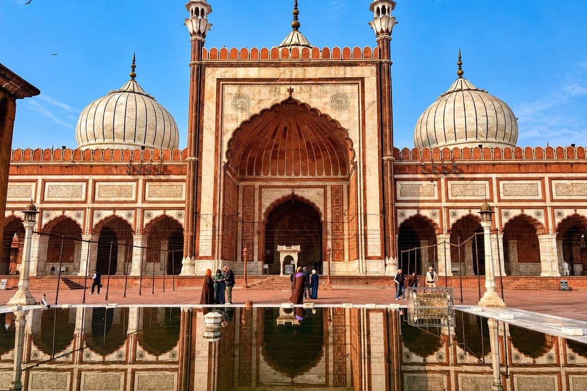 Jama Masjid reflected in the ablution tank, Delhi, India