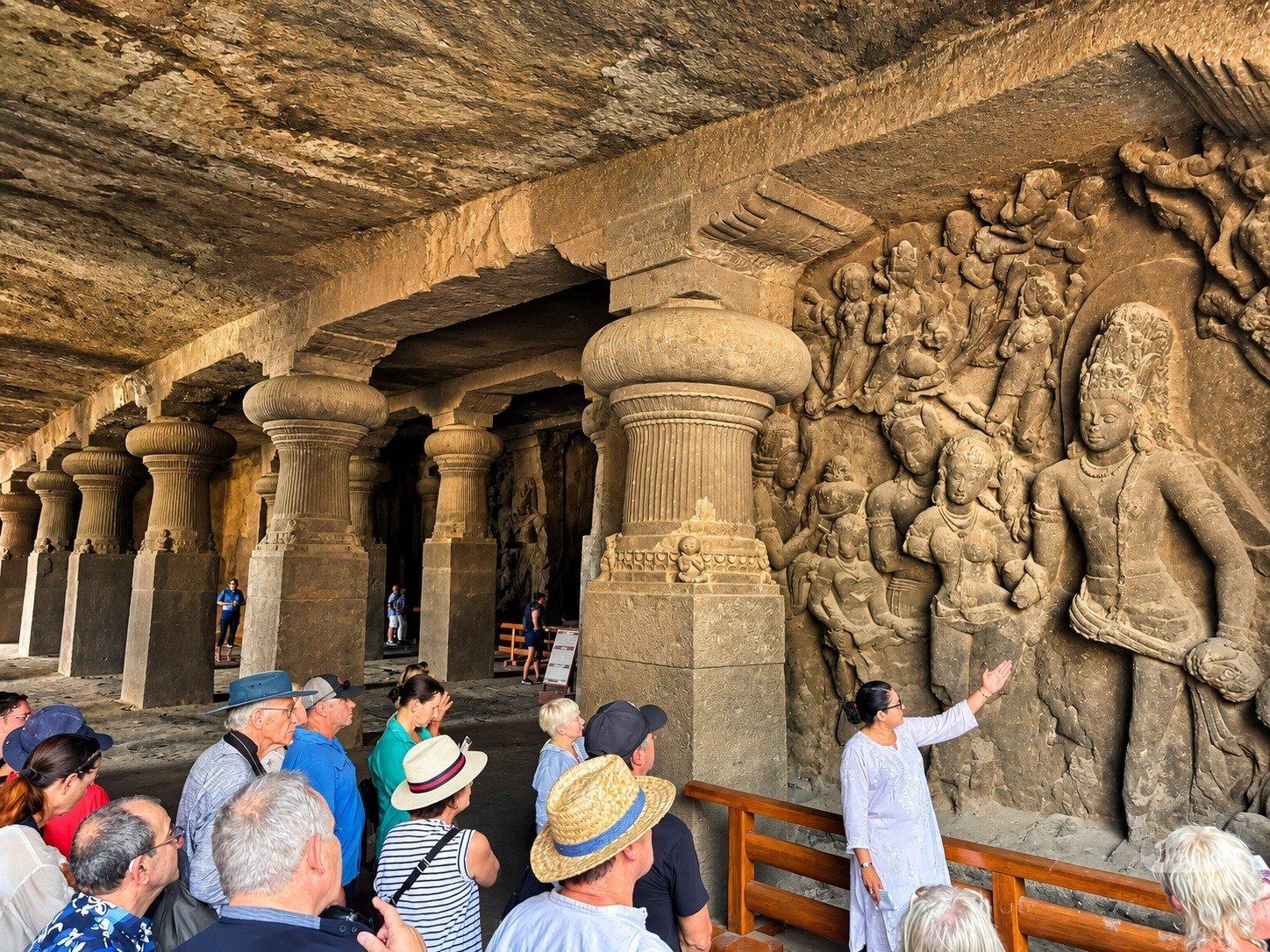 A guide explains the carvings