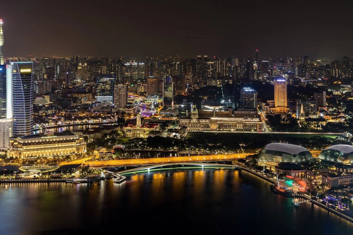 Night view over Marina Bay to the Esplanade's twin domes and the Civic District, Singapore