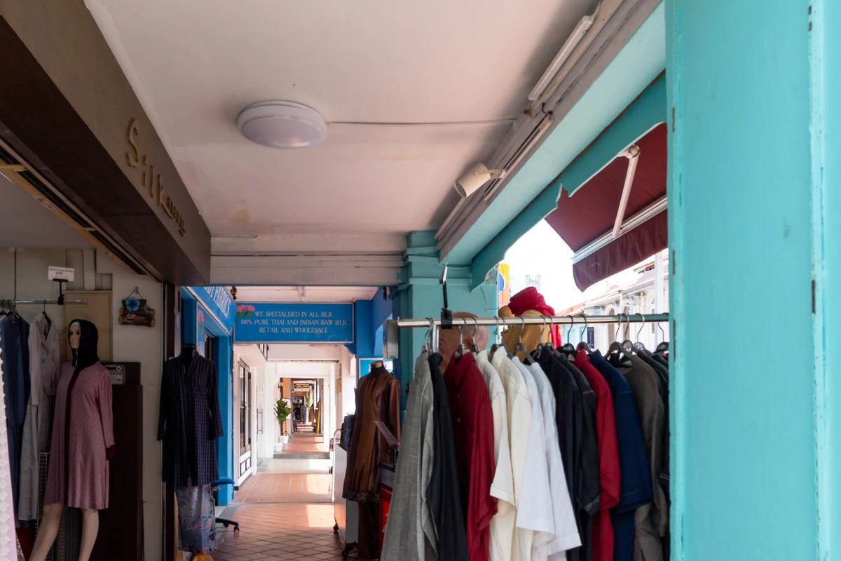 Clothes racks along a shop's covered walkway in Haji Lane, Singapore