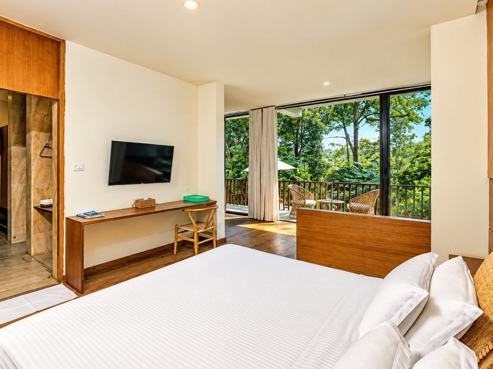 Kasara Resort – Villa bedroom with forest balcony