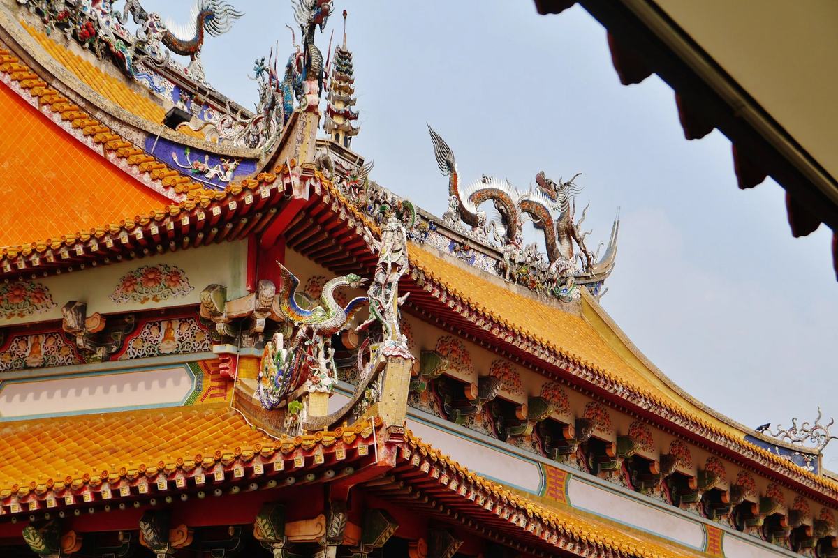 Dragons and glazed-tile eaves on a hall roof at Kong Meng San Phor Kark See Monastery, Singapore
