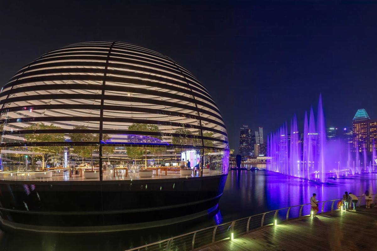 The floating glass dome at Marina Bay Sands and the Spectra light and water show at night, Singapore