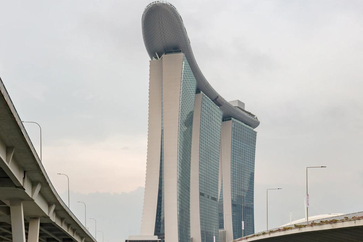 The three towers and SkyPark of Marina Bay Sands beyond the bay's road bridges, Singapore