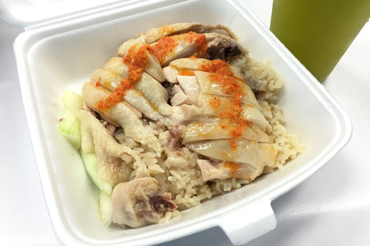 A box of Hainanese chicken rice with chilli from Maxwell Food Centre, Singapore
