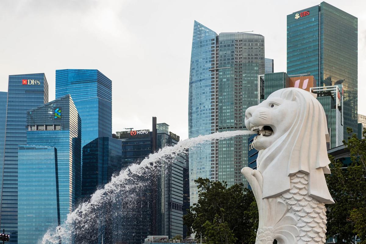 The Merlion spouting water in front of the CBD towers by day, Singapore