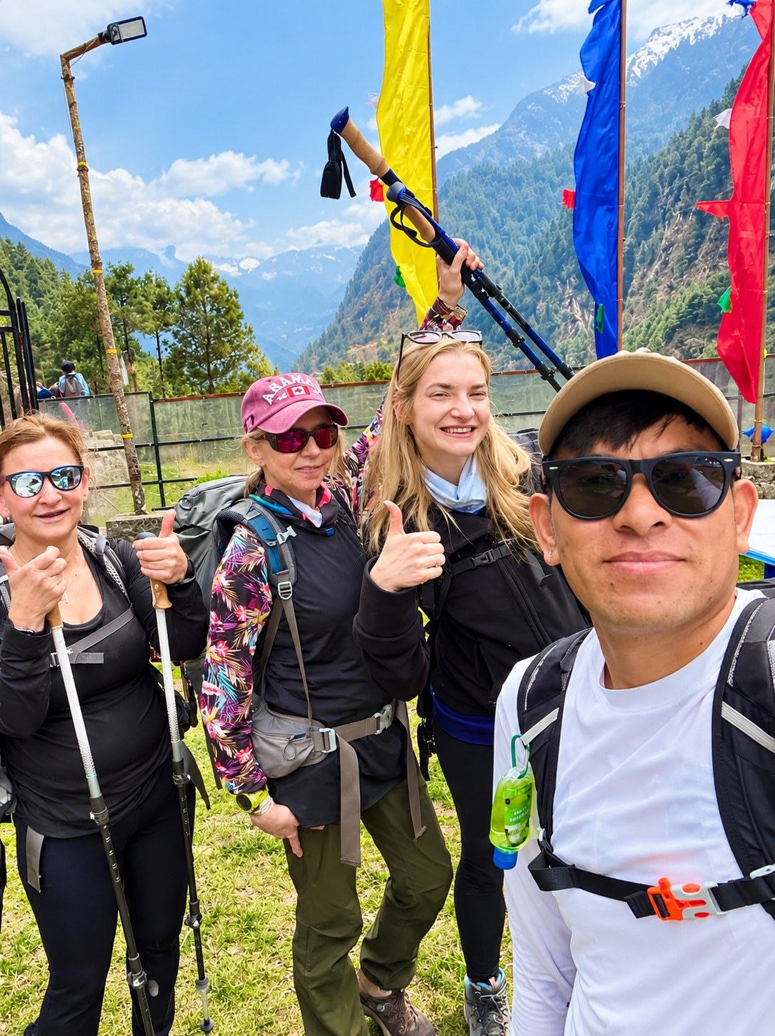 Mingmar Sherpa, Tour Leader, taking a selfie with HSJ trekkers on the trail in Nepal
