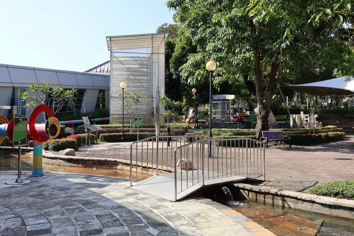 The outdoor garden and water channel at Science Centre Singapore