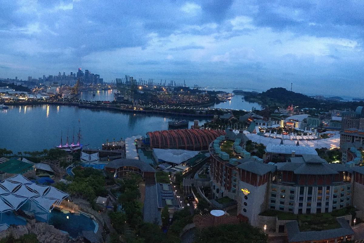 Evening view over Sentosa and Keppel Harbour to the city skyline, Singapore