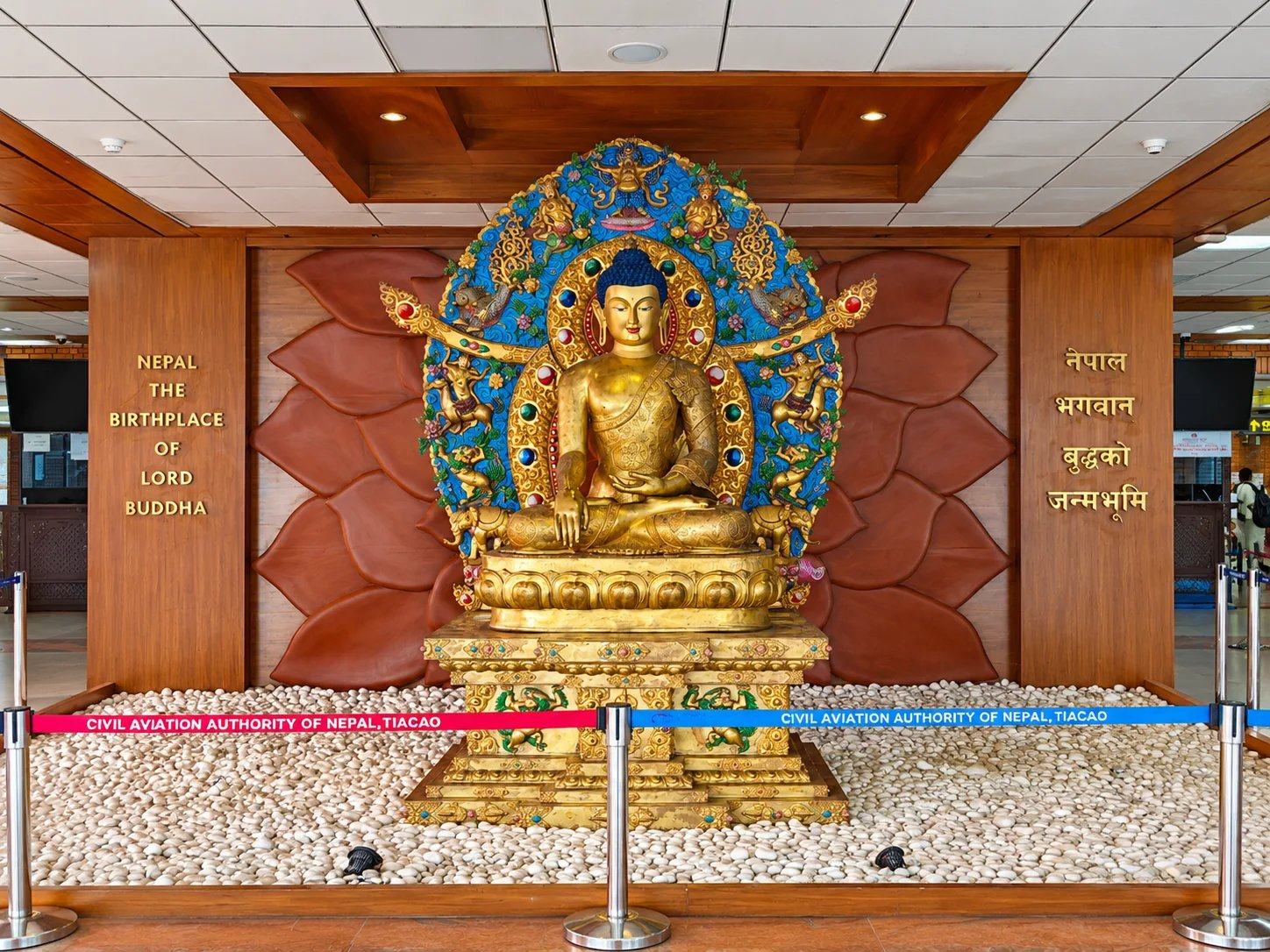 A golden Buddha shrine marking Nepal as the birthplace of the Buddha, Tribhuvan International Airport, Kathmandu