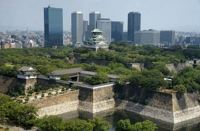 Osaka Castle among the trees and city towers