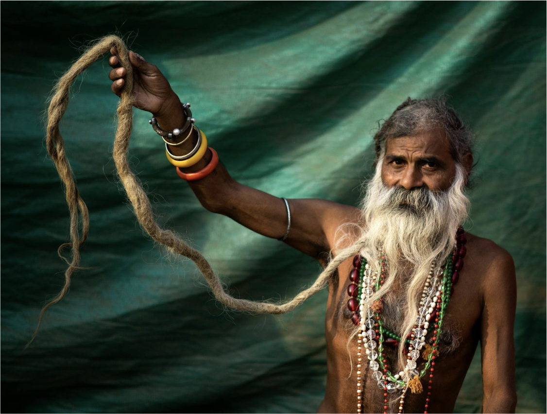 A Nāga Sadhu at the Kumbh Mela, with a uniquely long beard.