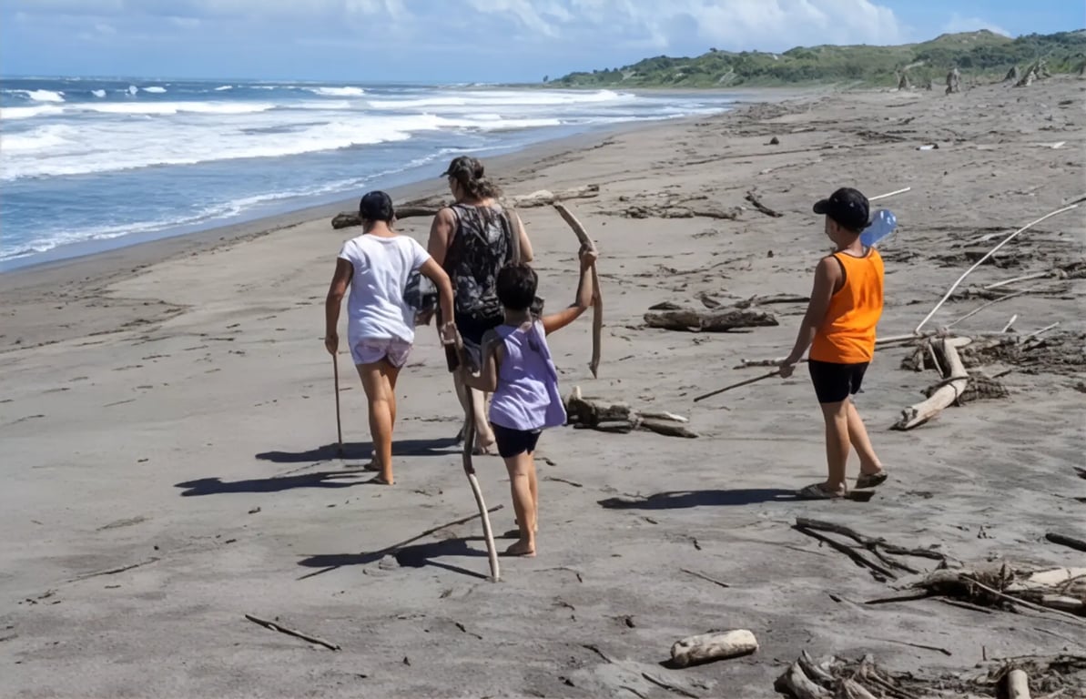 family walking on the beach