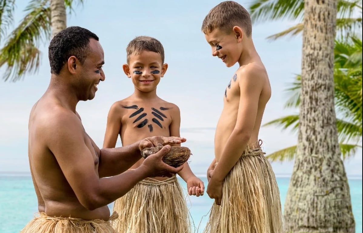 fijian man teaching kids about fiji culture
