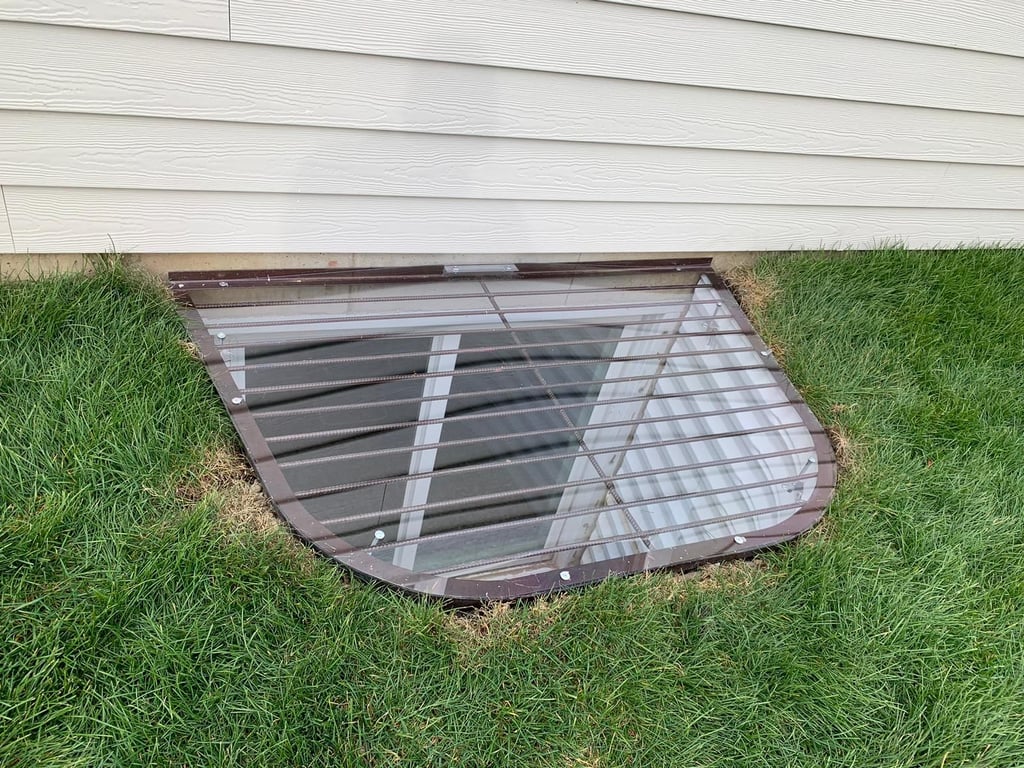 Standard clear overlay polycarbonate window well cover installed in Dolton Illinois
