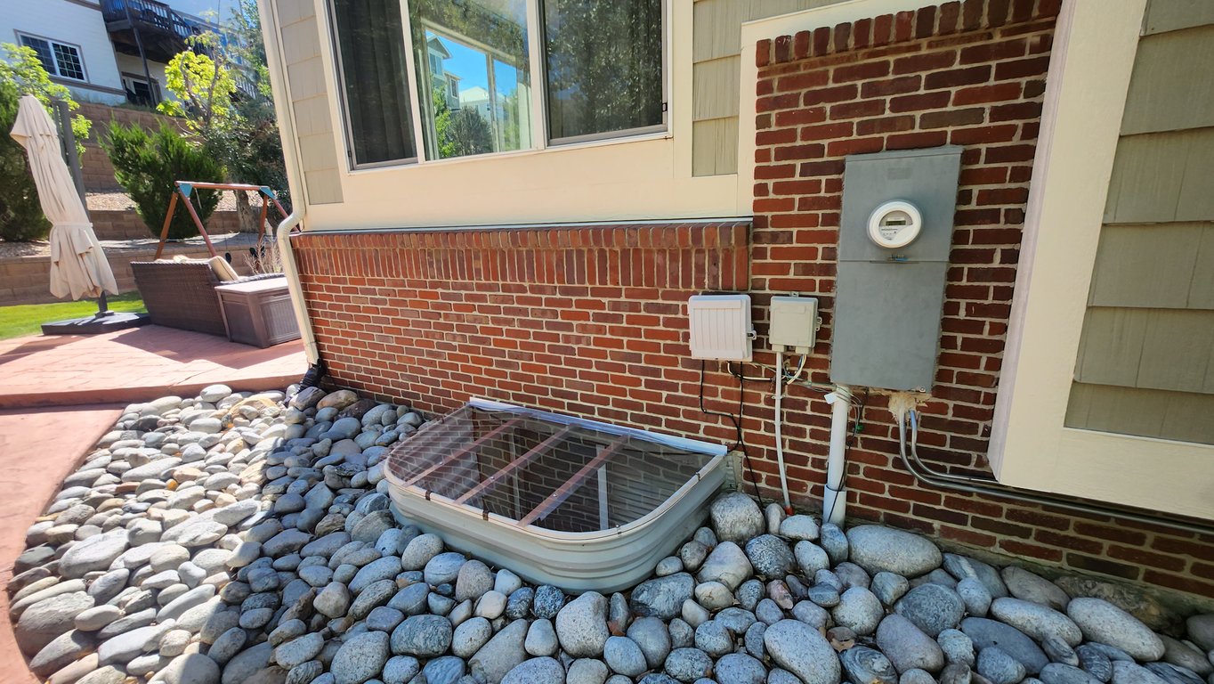 Clear polycarbonate window well cover custom made onsite for a 70x38 window well in Wheat Ridge Colorado