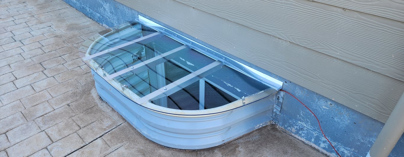 UV resistant crystal clear window well cover custom fabricated on site in South Barrington Illinois