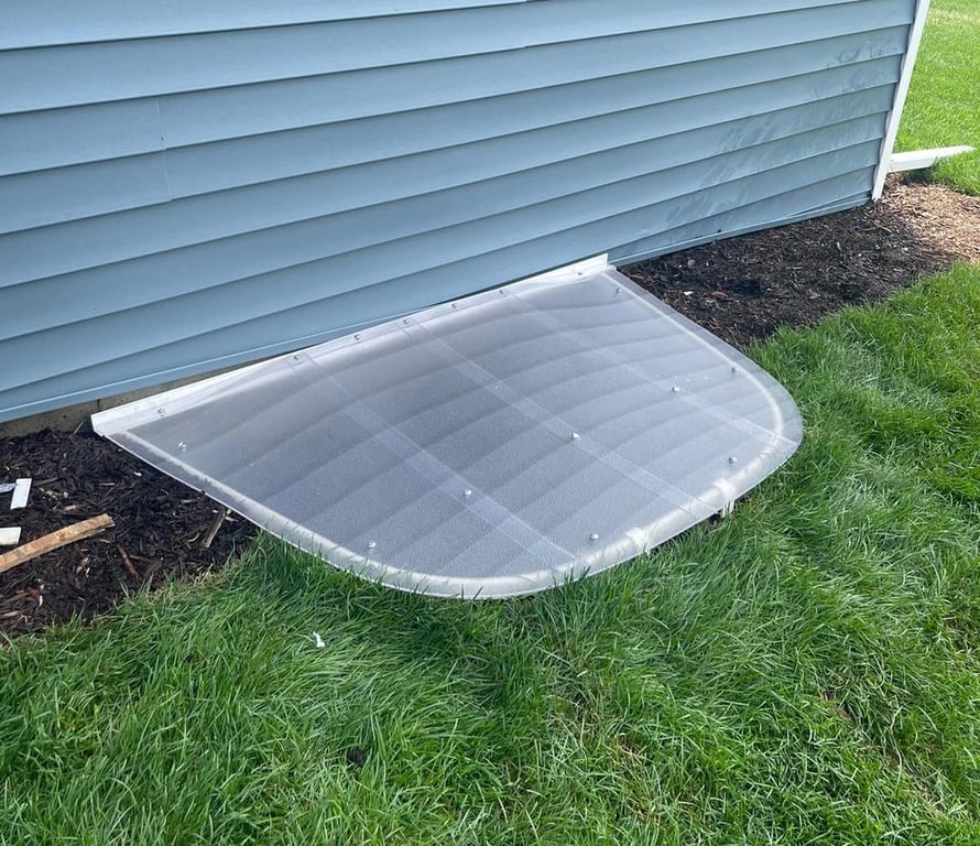 Frosted sloped polycarbonate window well cover with locks installed in Wheeling Illinois