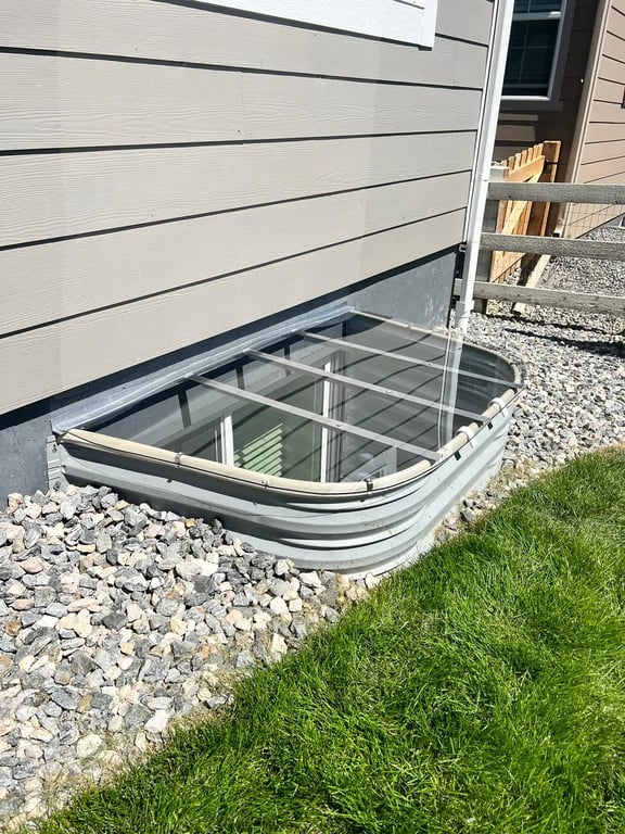 Polycarbonate and aluminum custom window well cover system installed in Black Forest Colorado