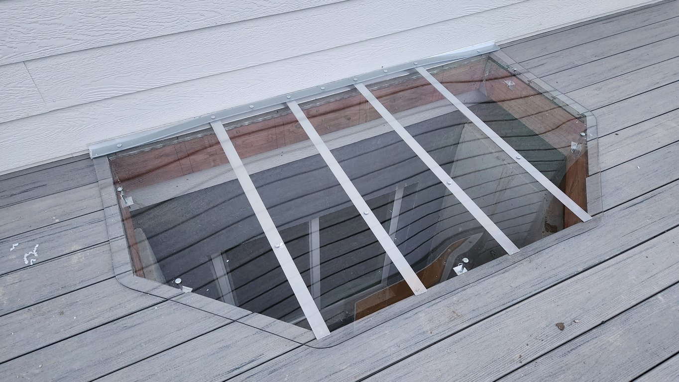 Hexagon shaped clear polycarbonate window well cover installed on deck Blue Island Illinois