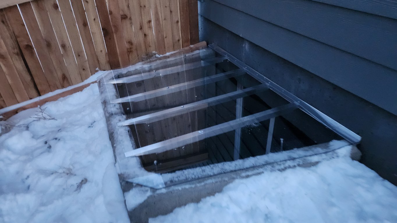 Crystal clear window well cover improving safety and appearance installed in Barrington Illinois
