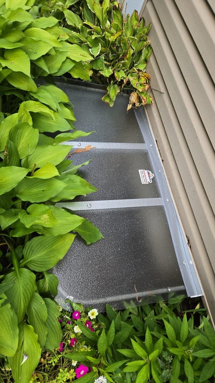 Frosted window well cover installed in Greenfield Wisconsin to reduce glare and debris