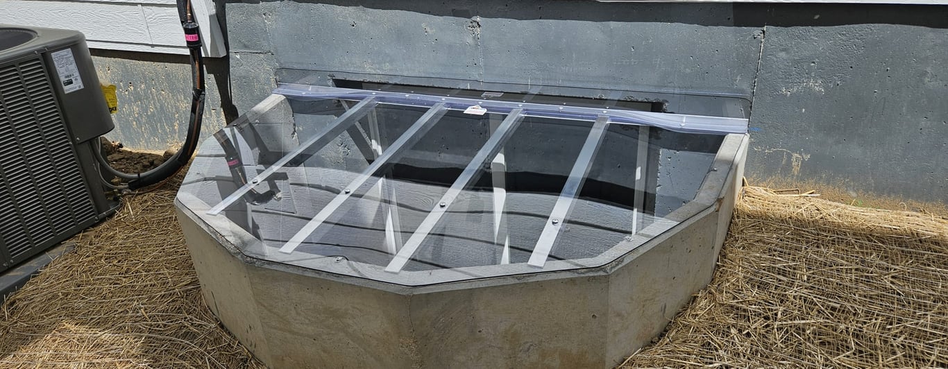 Clear polycarbonate window well cover with vertical extension installed in Warrenville Illinois