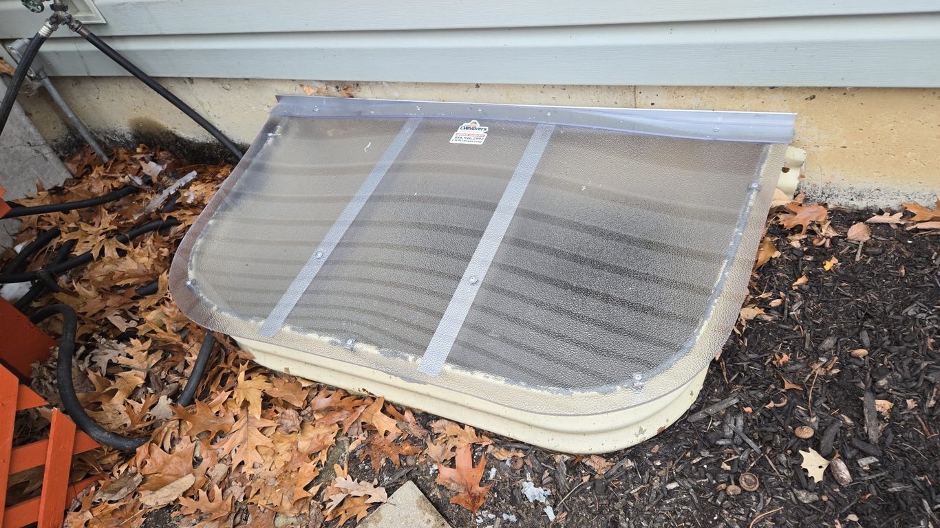 Matte finish frosted polycarbonate window well cover enhancing exterior appearance in Yorkville Illinois