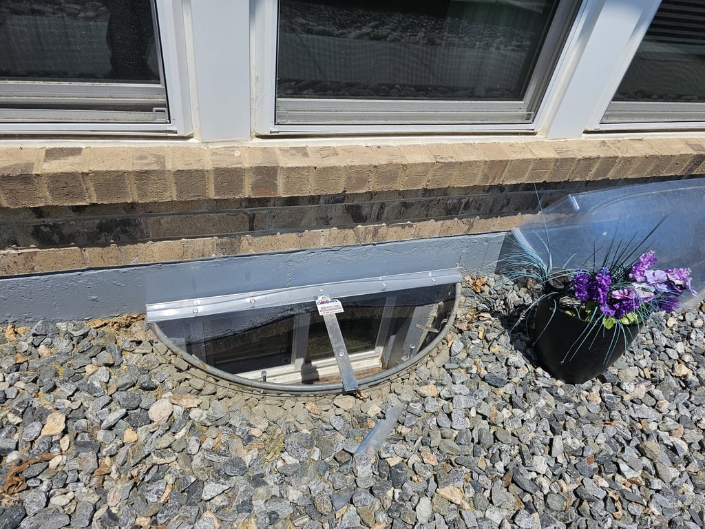 Small sloped custom window well cover made onsite in Dolton Illinois