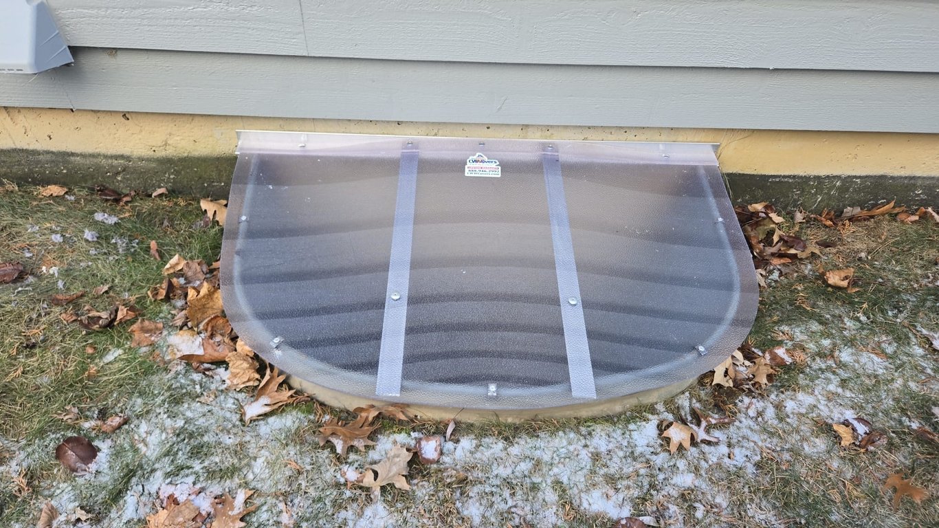 Frosted polycarbonate window well cover preventing debris and water entry in Yorkville Illinois