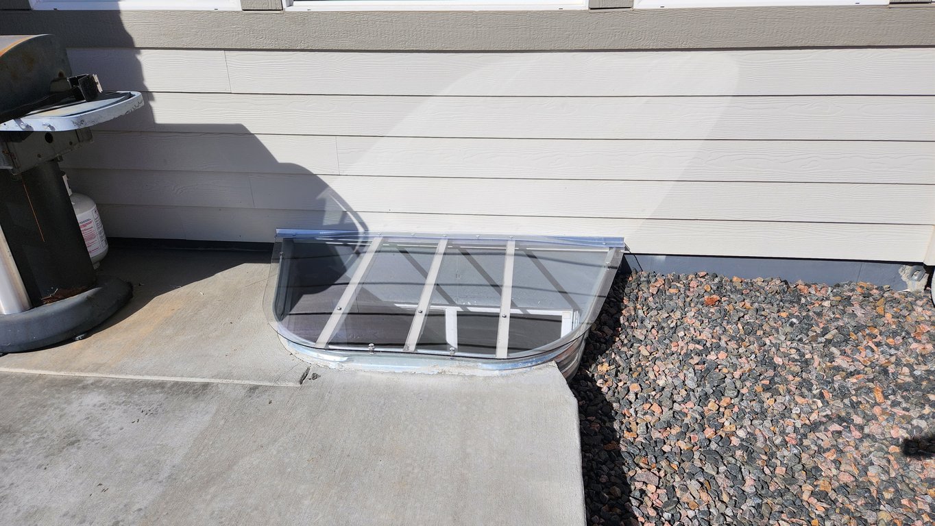 Clear polycarbonate window well cover installed in Streamwood Illinois