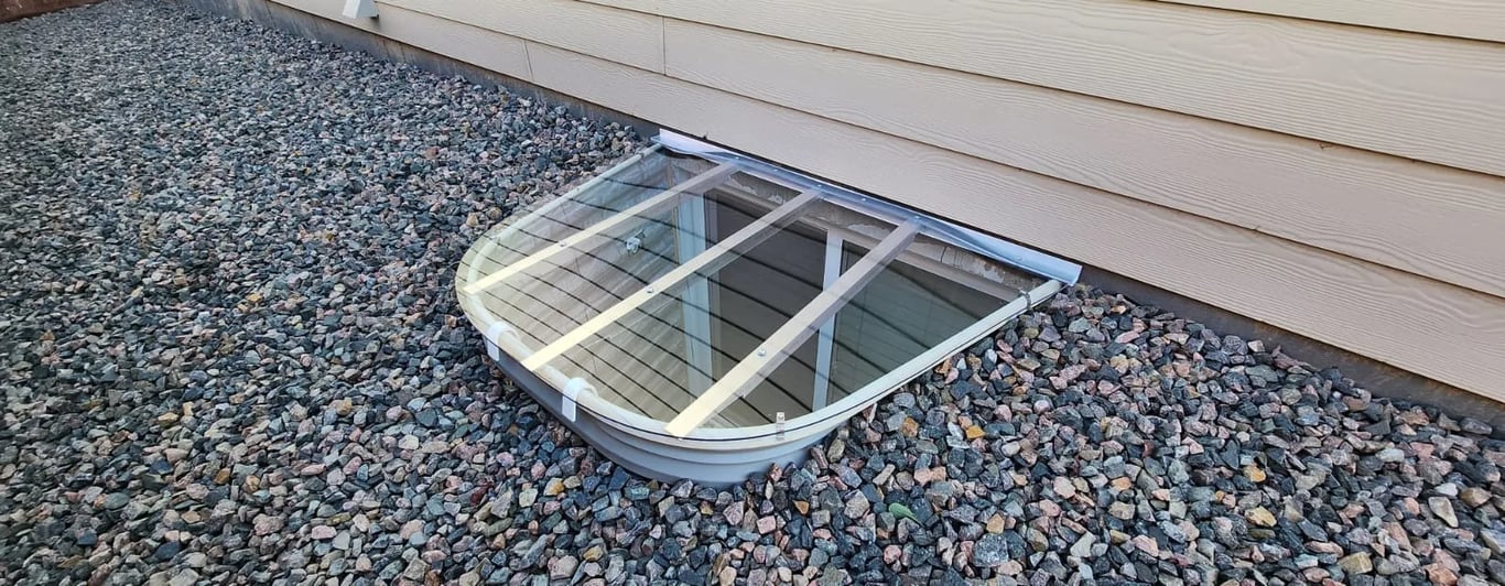 Sloped polycarbonate window well cover with clips installed in La Grange Park Illinois