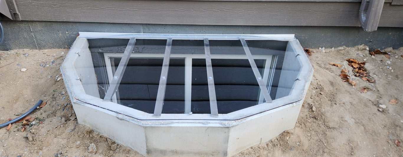 Clear polycarbonate window well cover 75x45 with clips installed in Lisle Illinois