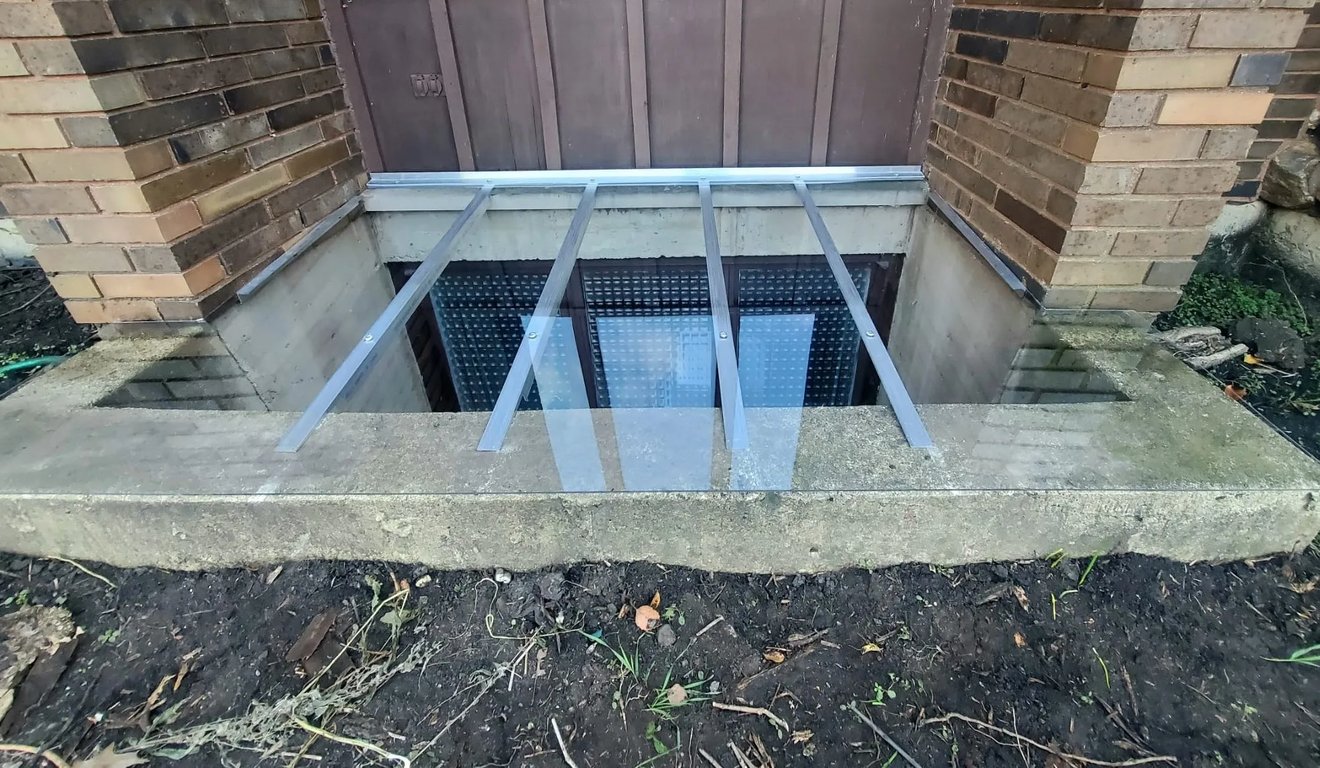 Large concrete window well cover 70x65 installed in Summit Illinois