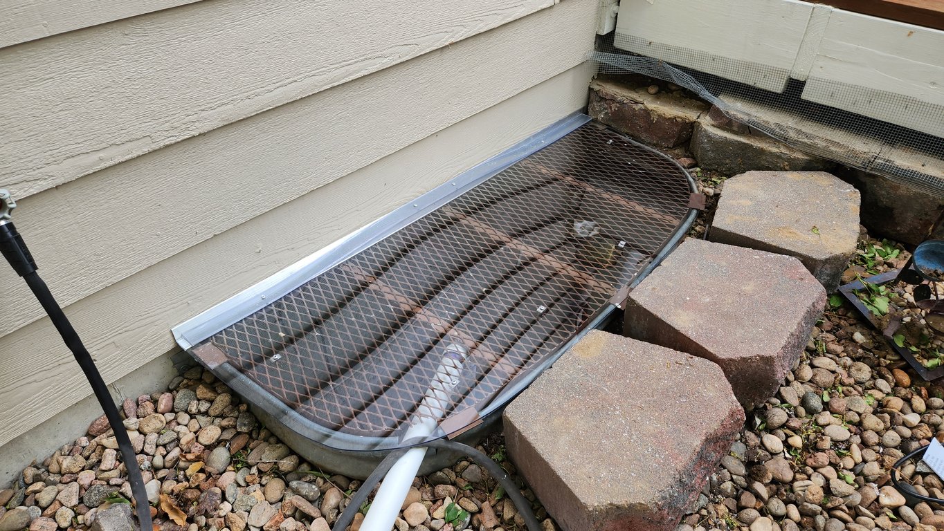 Overlay window well cover solution installed in Oak Brook Illinois over an existing metal window well grate